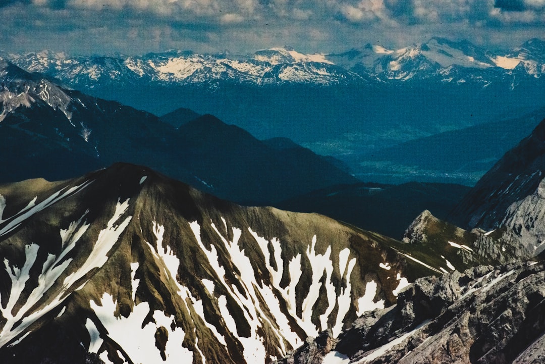 grey and white snow capped mountain peak