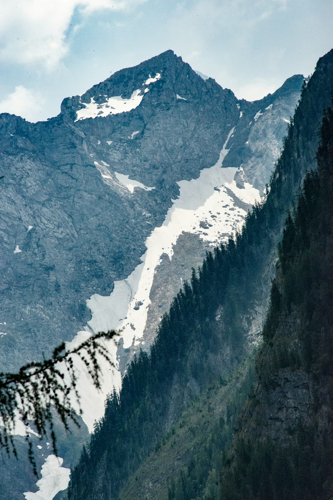 white snow on grey rocky mountain