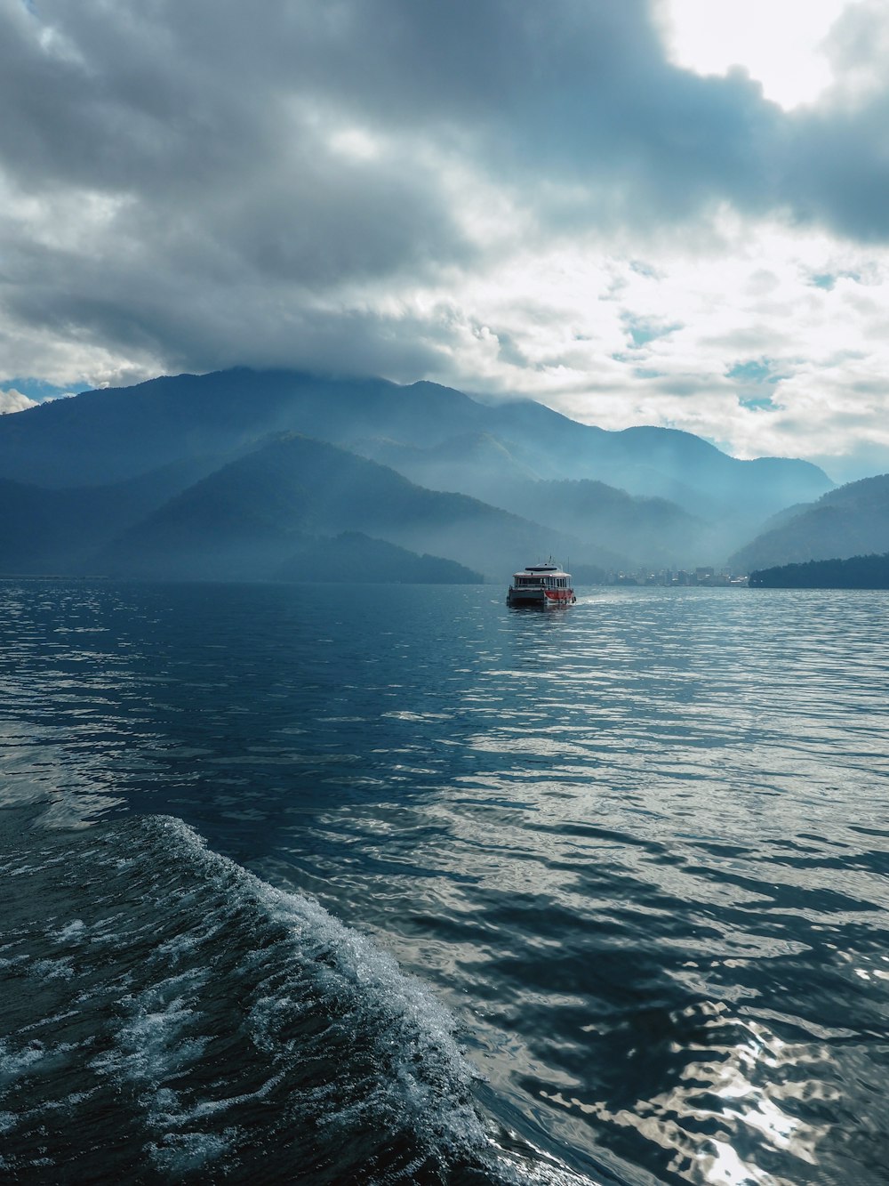 boat sailing on body of water