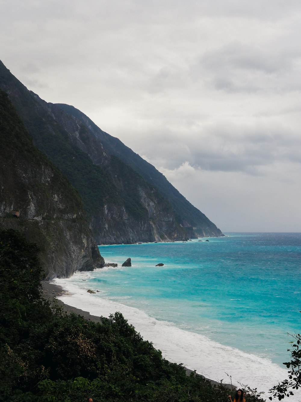 landscape photography of mountain beside body of water