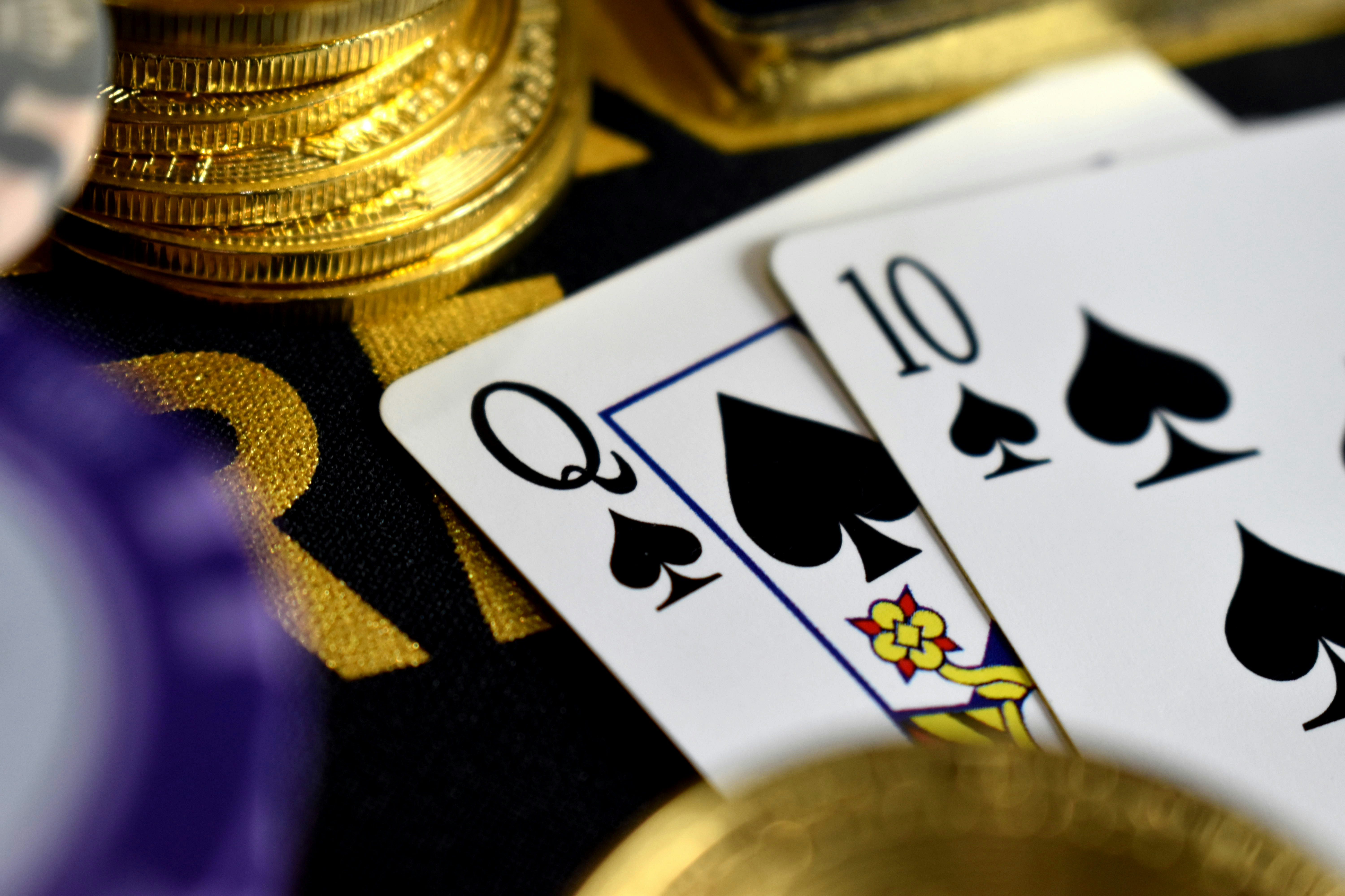 two playing cards among poker chips