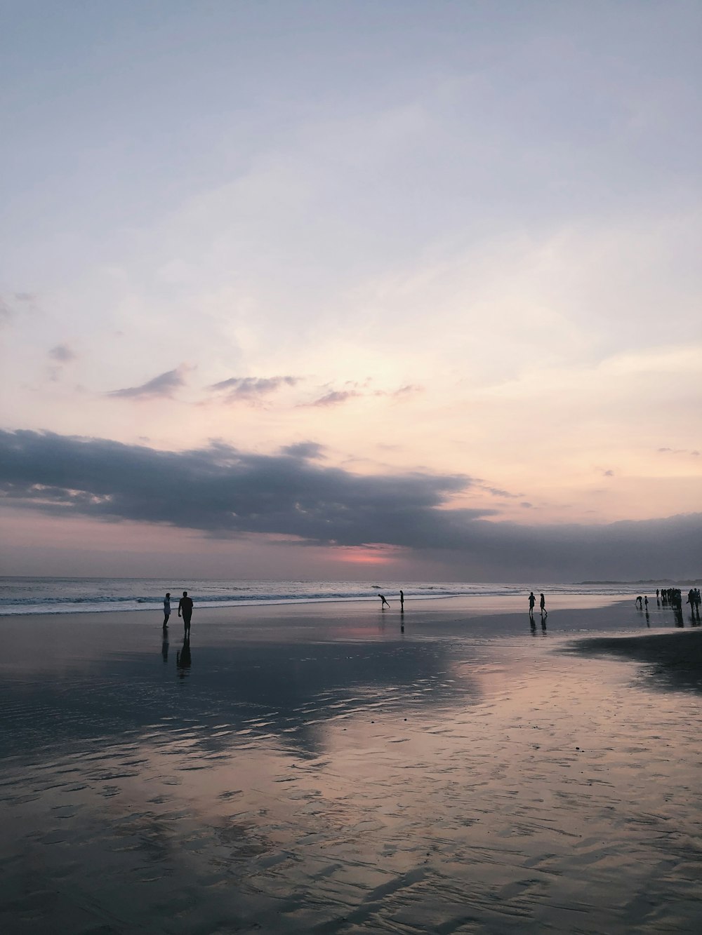 people walking on shore