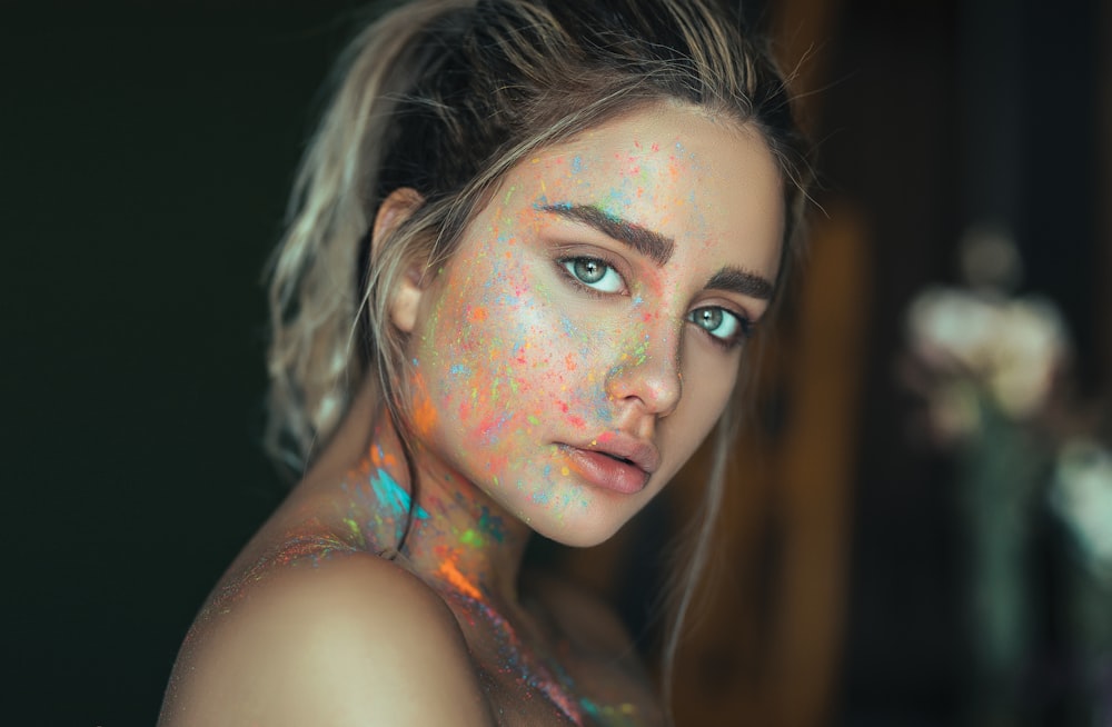 woman with multicolored face paint