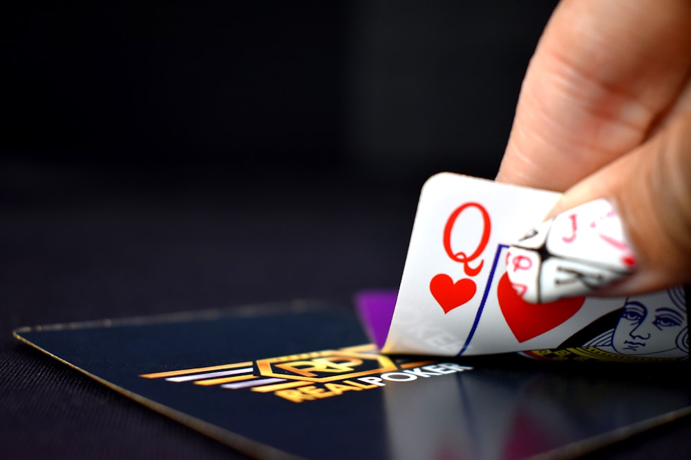 selective focus photography of queen of hearts playing card