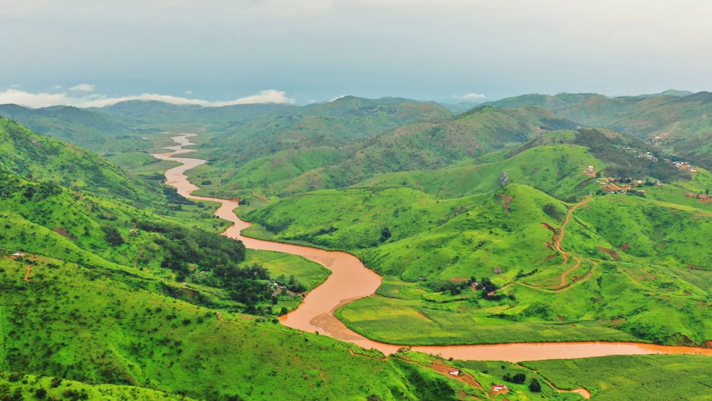 a river running through a lush green valley