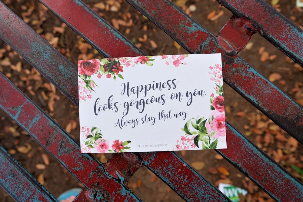 a sign that is on a red bench