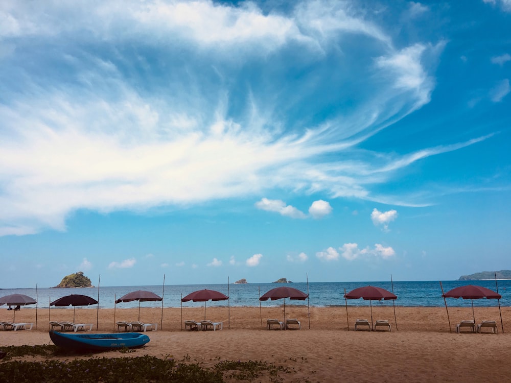 blue canoe boat seashore scenery