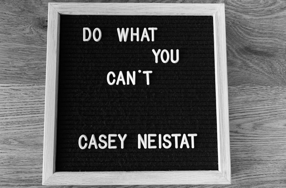 white wooden framed Do What You Can't by Casey Neistat quote