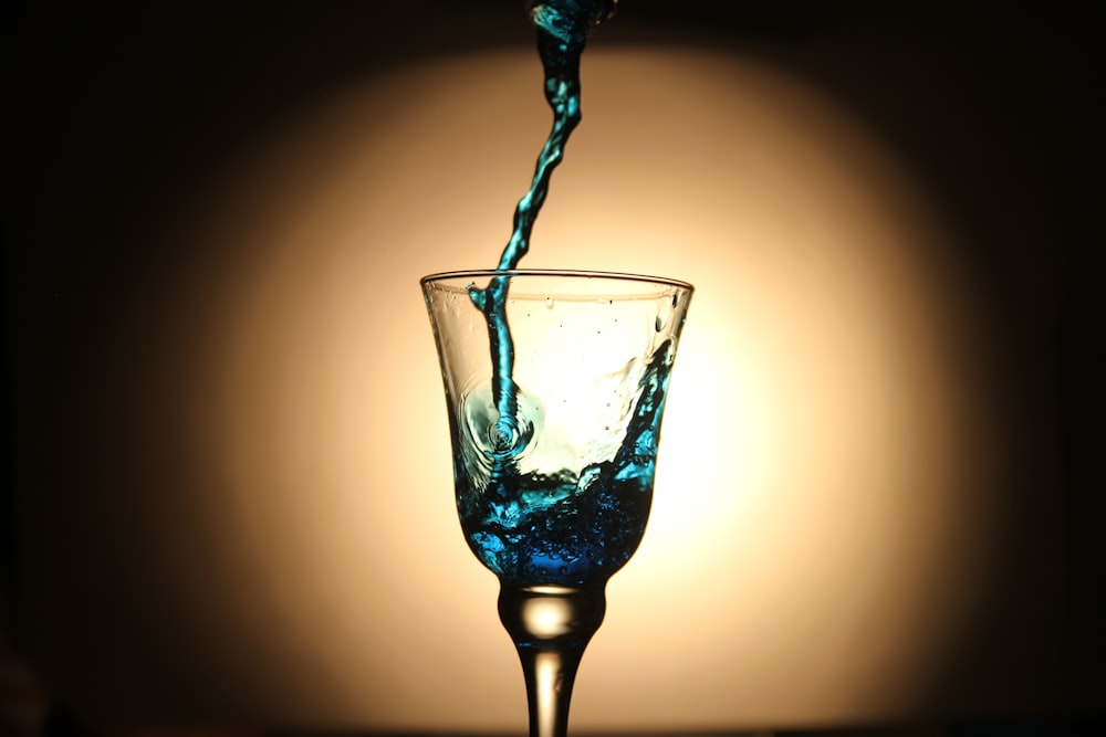 cocktail glass with blue liquid substance