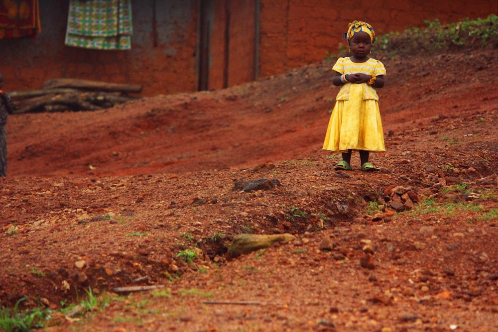 girl standing on hill