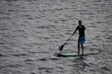 person paddleboarding