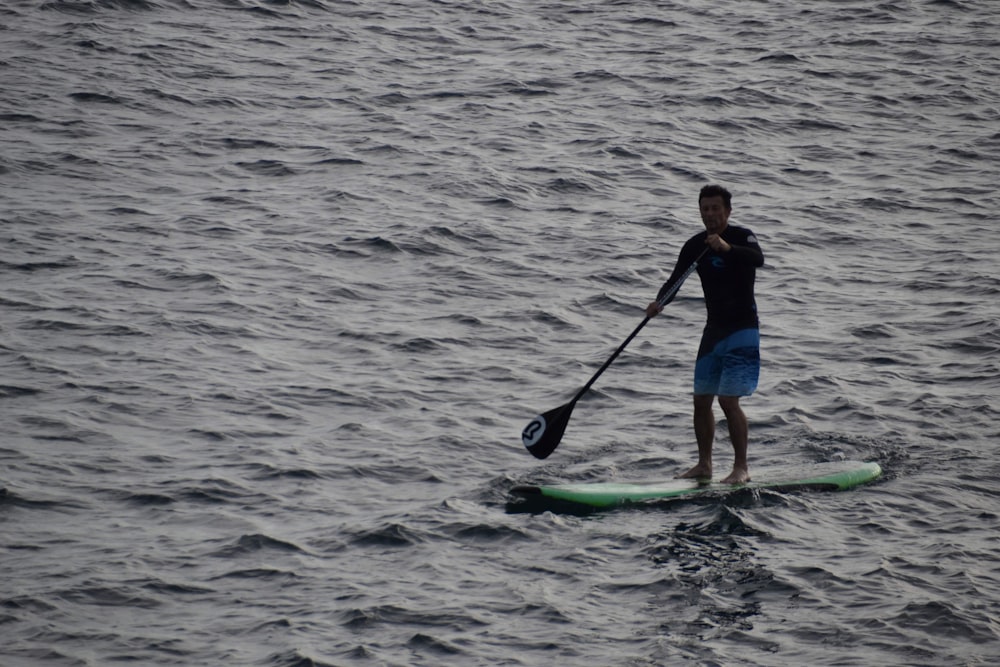 person paddleboarding