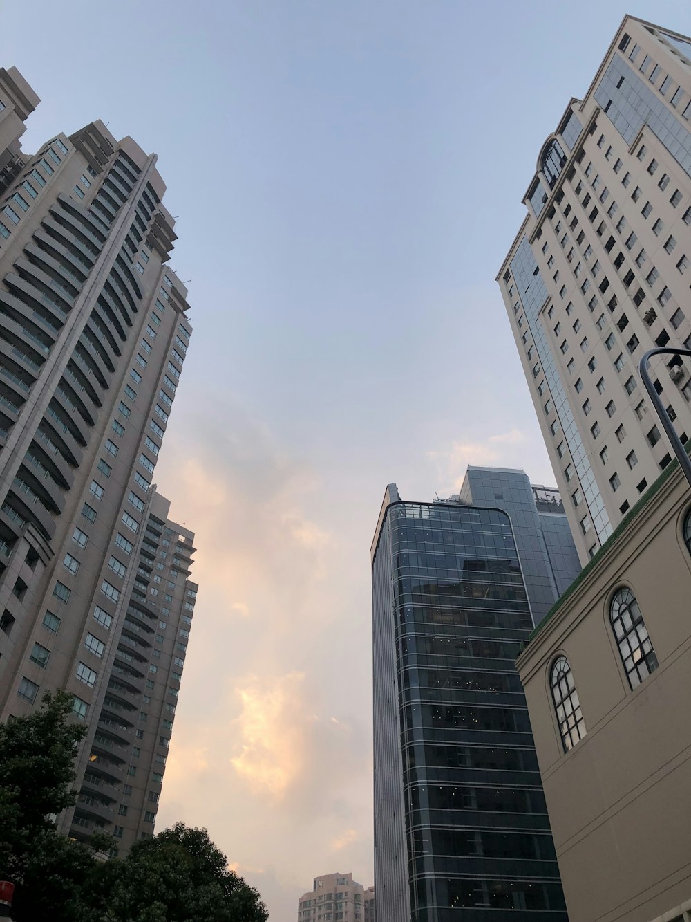 worm view photo of gray concrete buildings during daytime