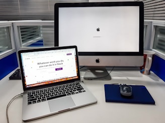 silver iMac near space gray MacBook Pro