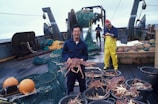 A fisherman showcasing a catch of live crabs.