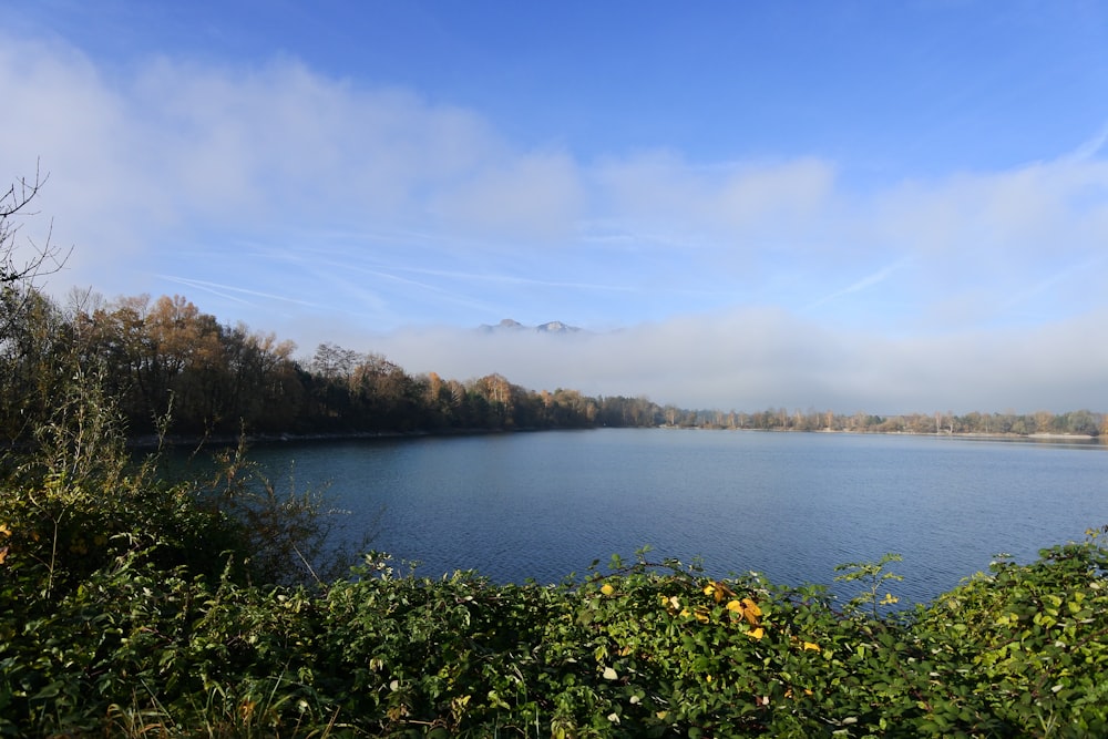 body of water under cloudy sky during daytime