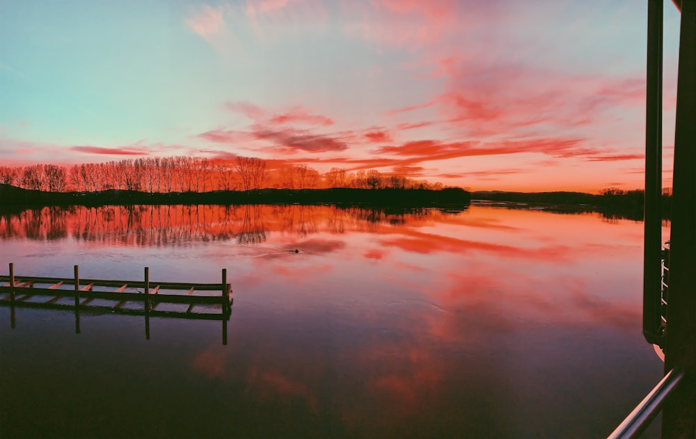 body of water under cloudy sky during daytime