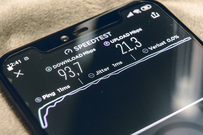 Smartphone running a WiFi speed test to verify network performance