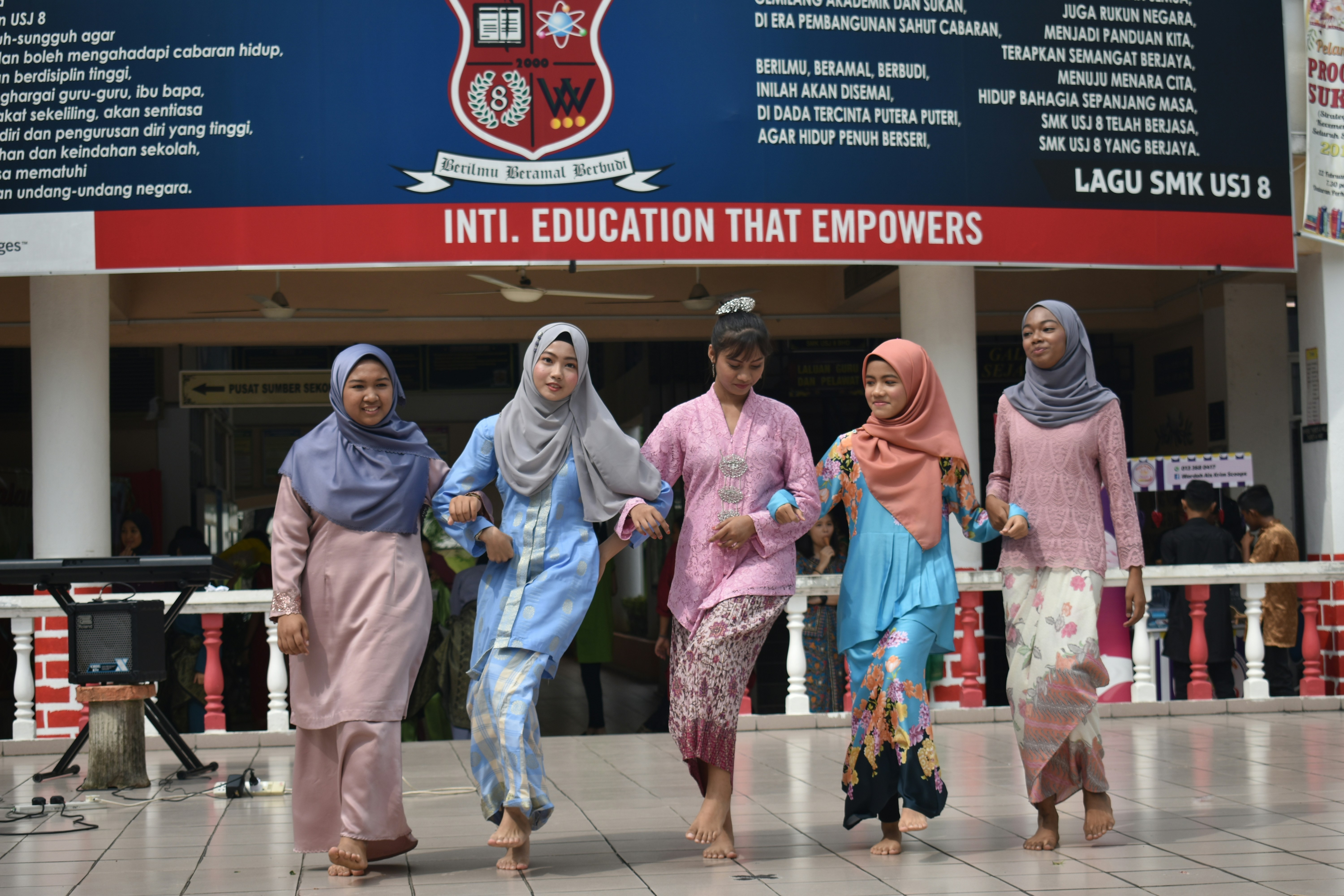 Traditional dancers during Hari Raya celebration at a school