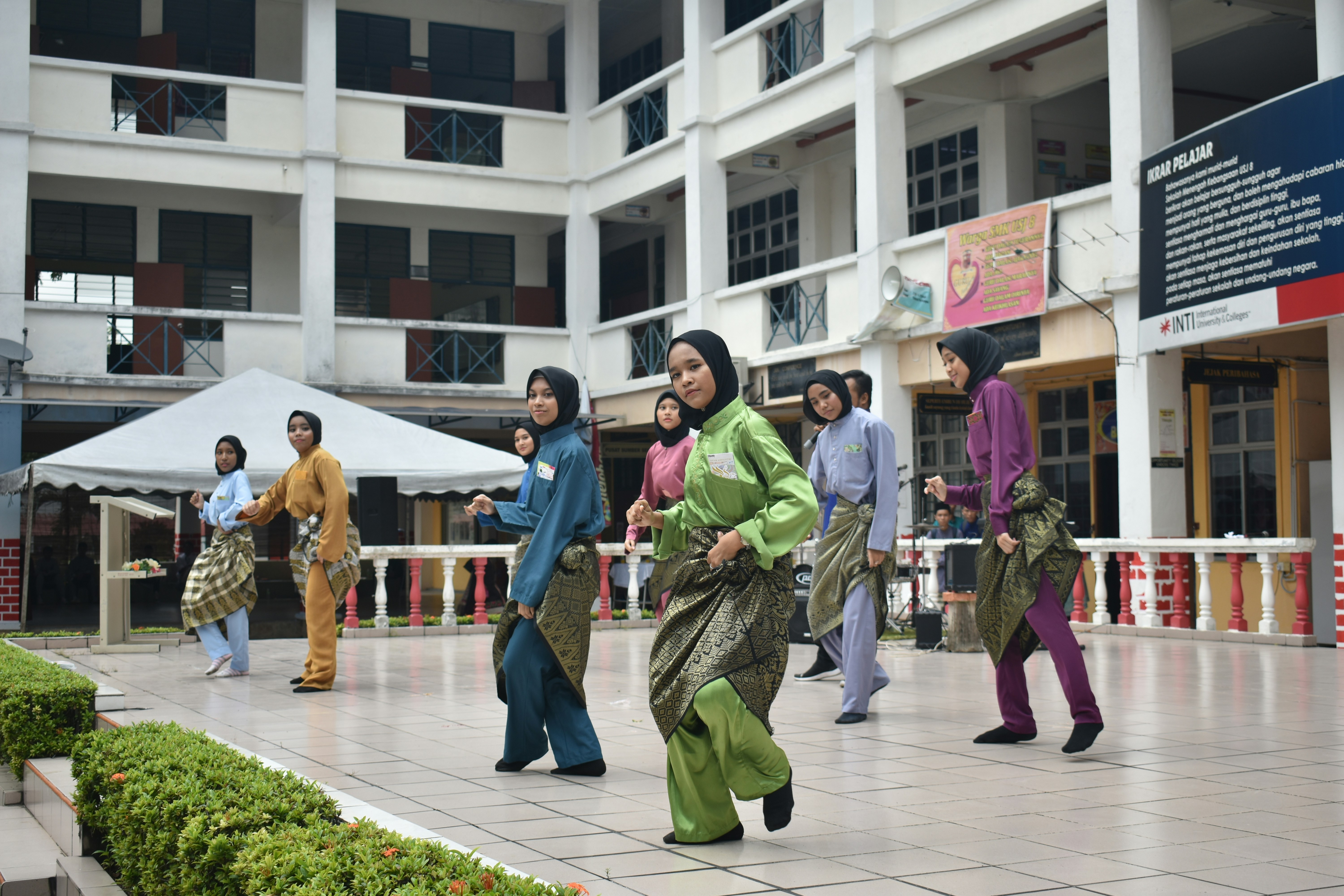 Traditional dancers during Hari Raya celebration at a school