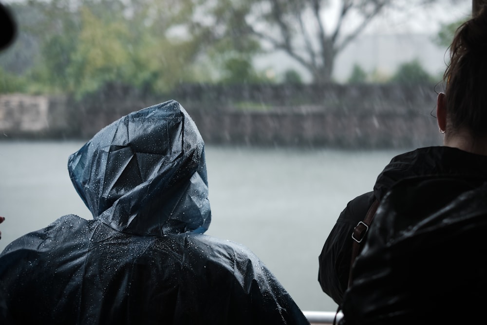 person wearing blue raincoat