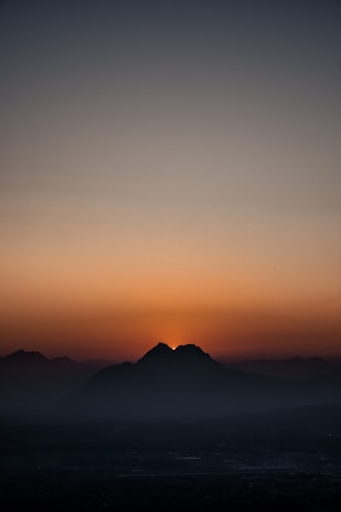 A serene sunrise over Mount Merbabu viewed from the village.