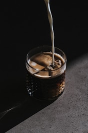 beverage pour on clear drinking glass