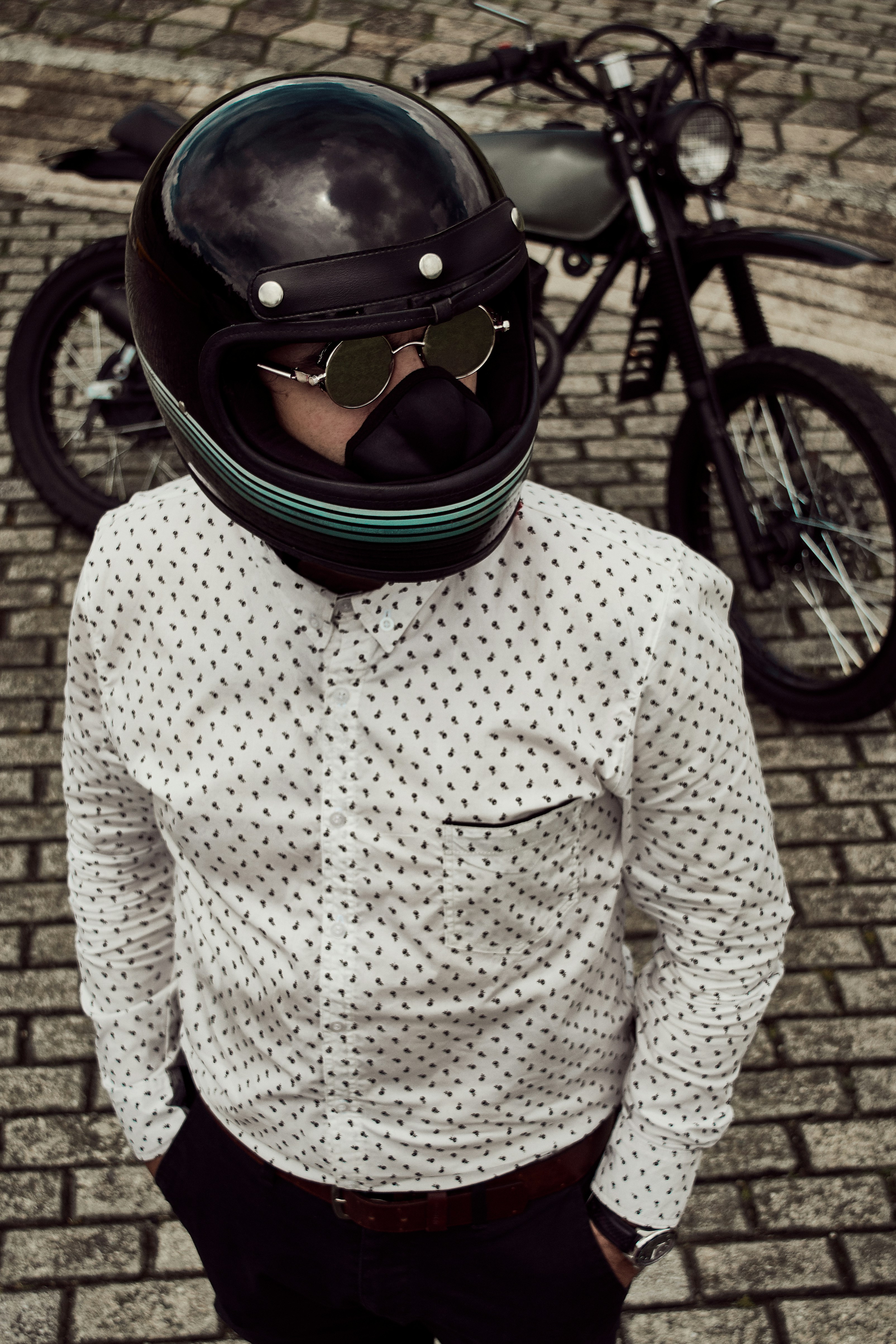 man in formal attire wears helmet