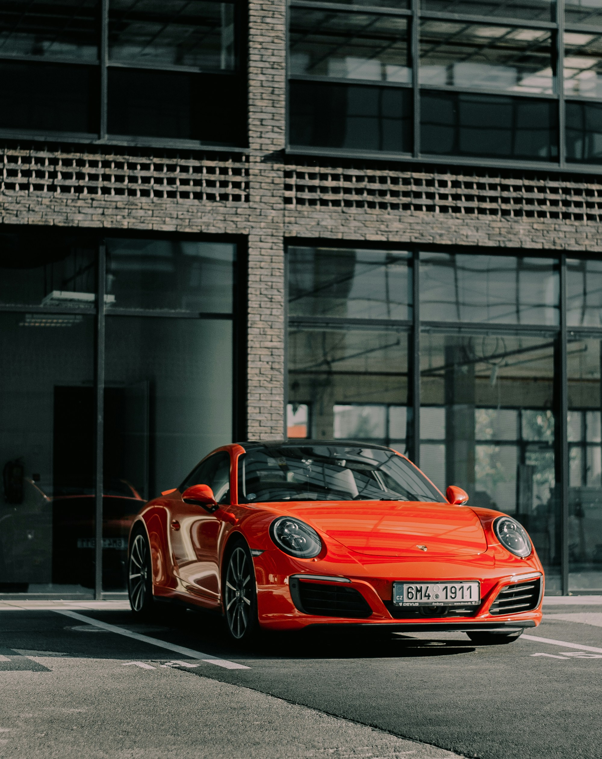 red coupe on driveway