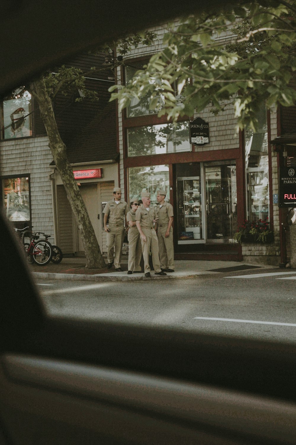 group of officers standing on sidewalk
