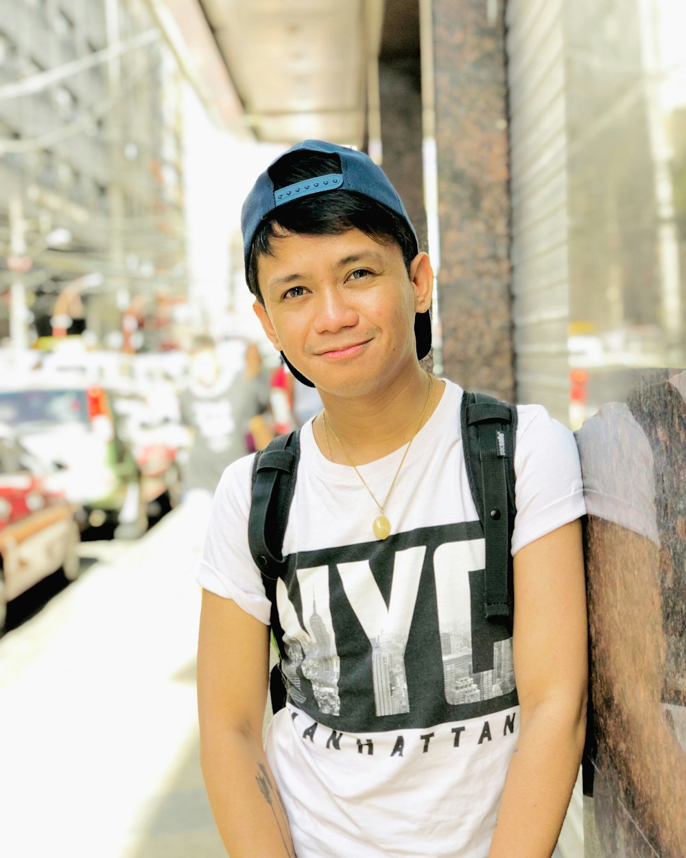 selective focus photography of man leaning on wall