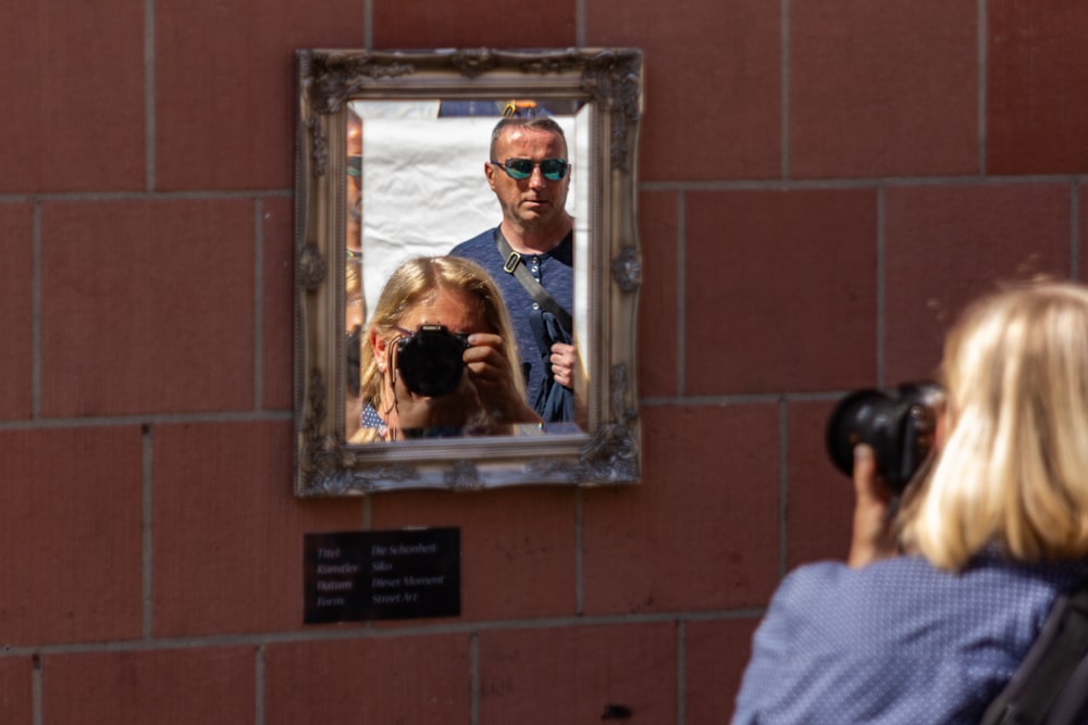 brown wooden framed wall mirror