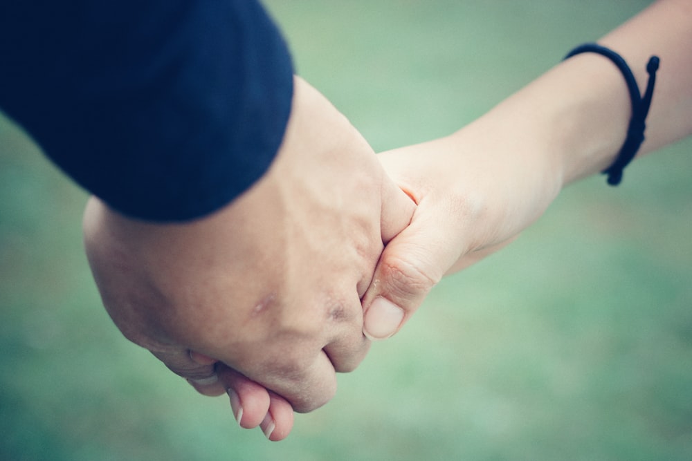 man and woman holding hands