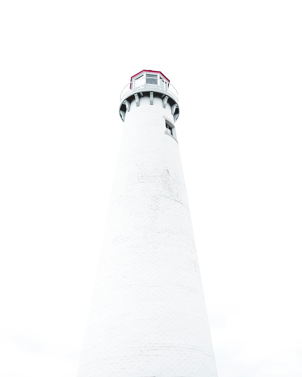low-angle photography of white light house