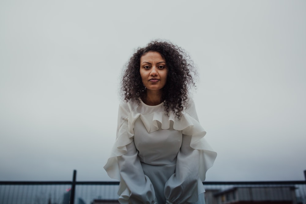 woman standing and looking straight