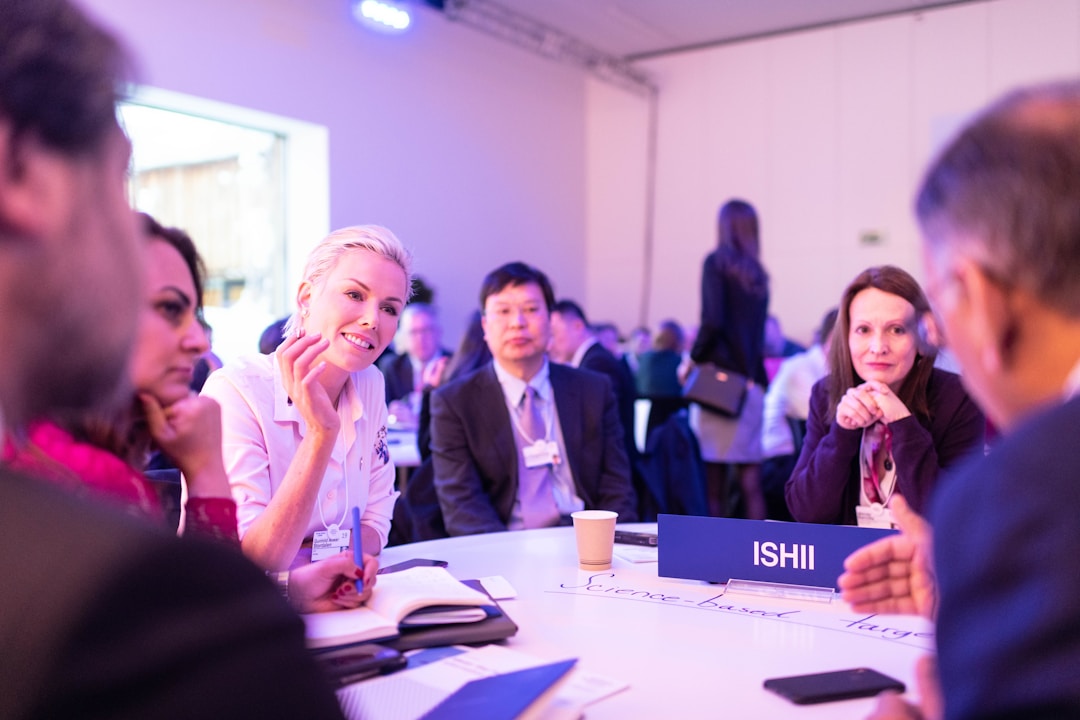 Employees networking at a business event to expand the customer base