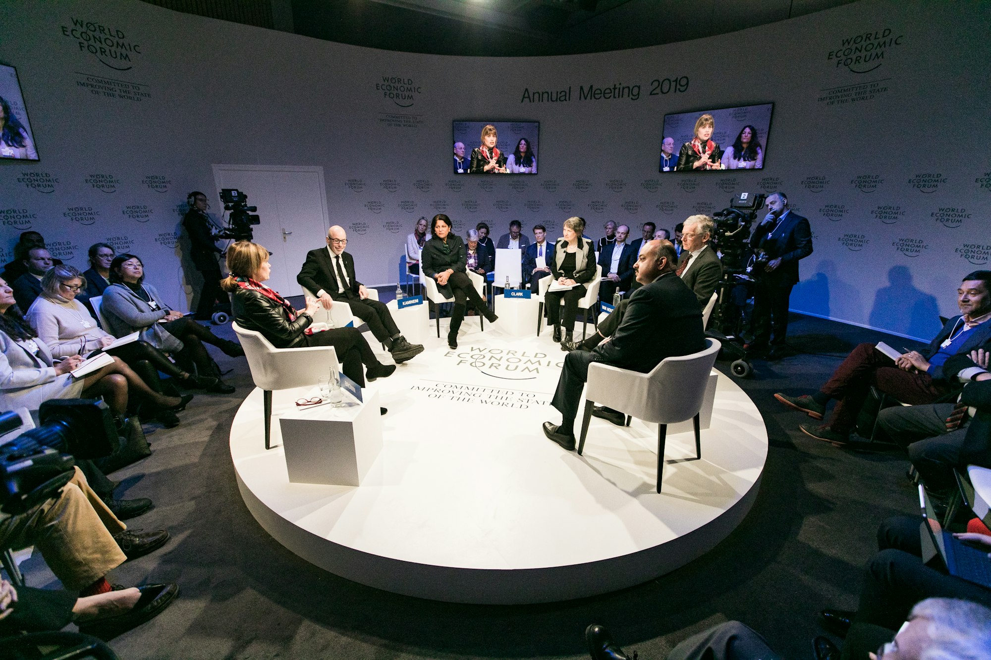 People speaking at a press conference in Davos.