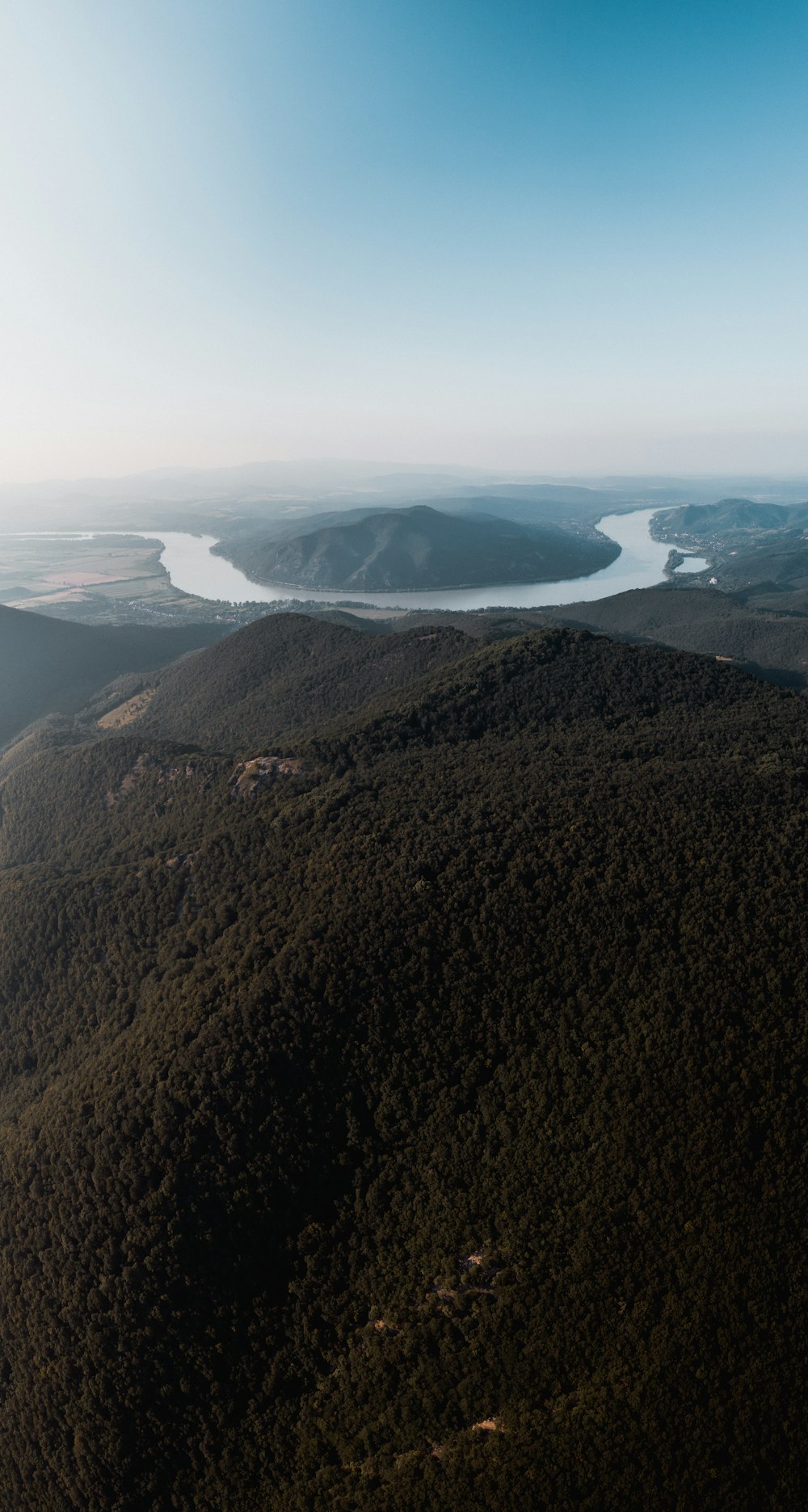 green hills and river in aerial photography