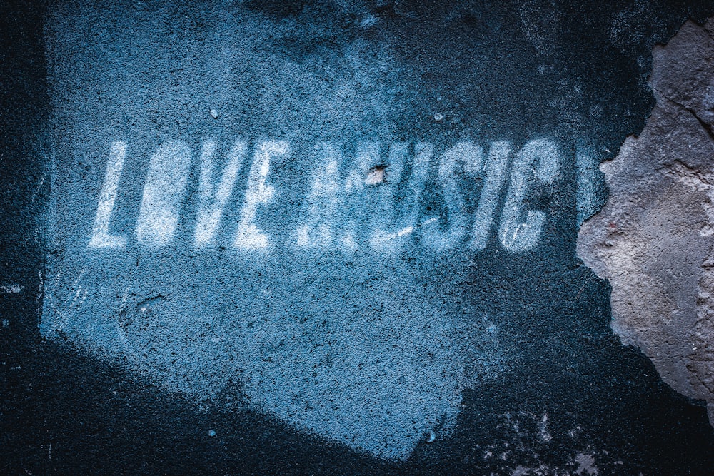 love music text overlay on blue bacckground