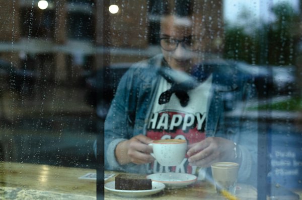 Woman sitting with coffee in a quiet cafe