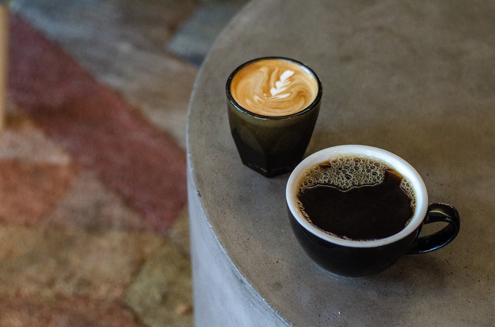 two cups with coffee on table