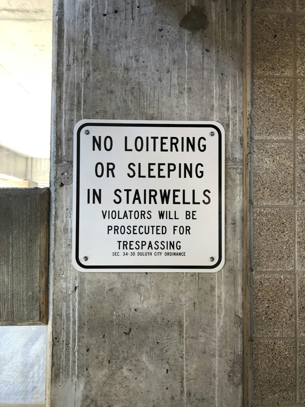 no loitering or sleeping in stairwells sign