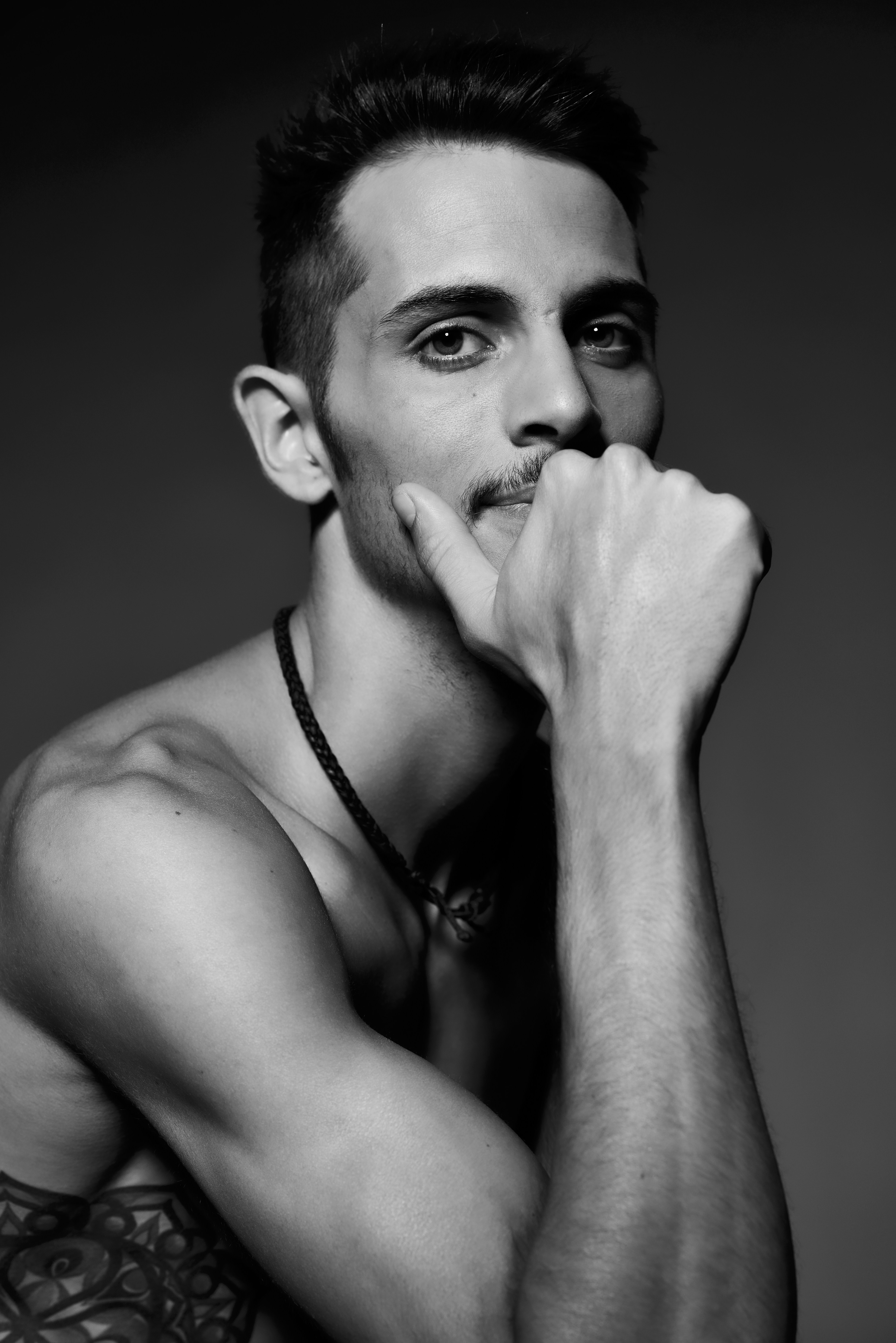 Man wearing necklace in grayscale photo photo Free Portrait Image on Unsplash