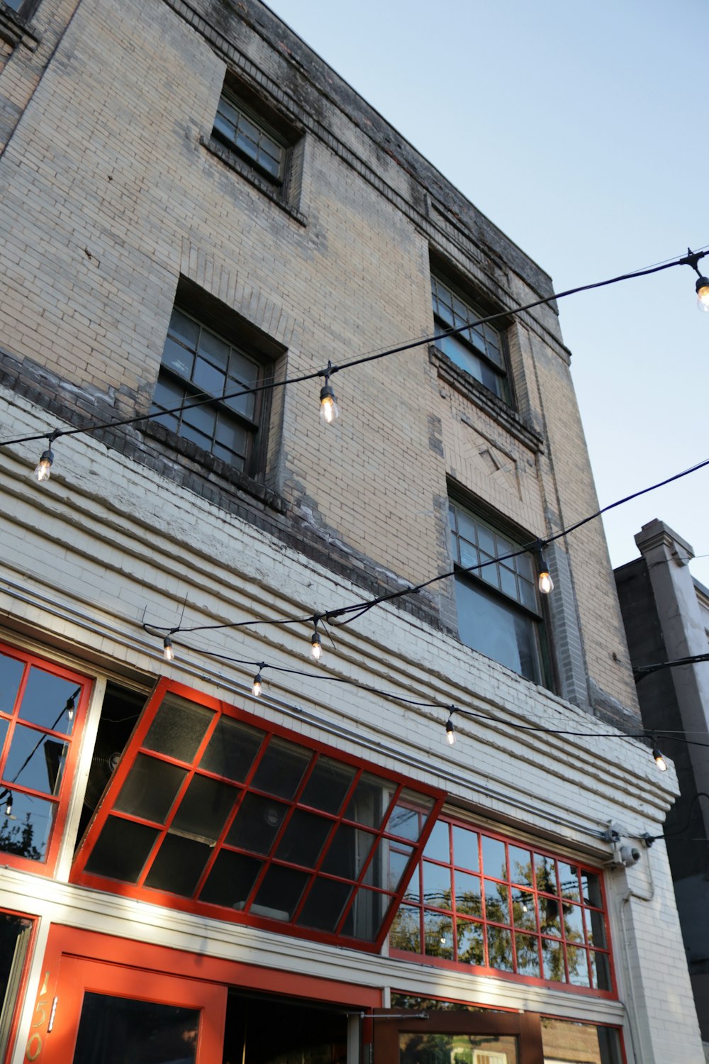 red and grey building with lights hanging