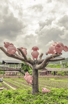 A colorful illustration of various pig characters set against a city skyline.