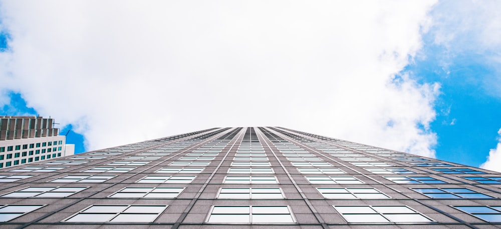 worms-eye-view photography of white city buildings