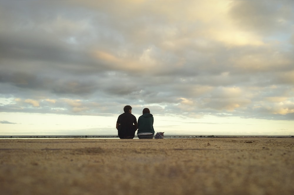 unknown persons sitting outdoors