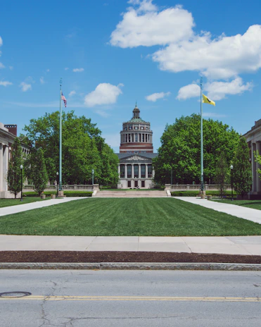 A scenic shot of the campus library exterior on a clear day, symbolizing dedication to academic growth.