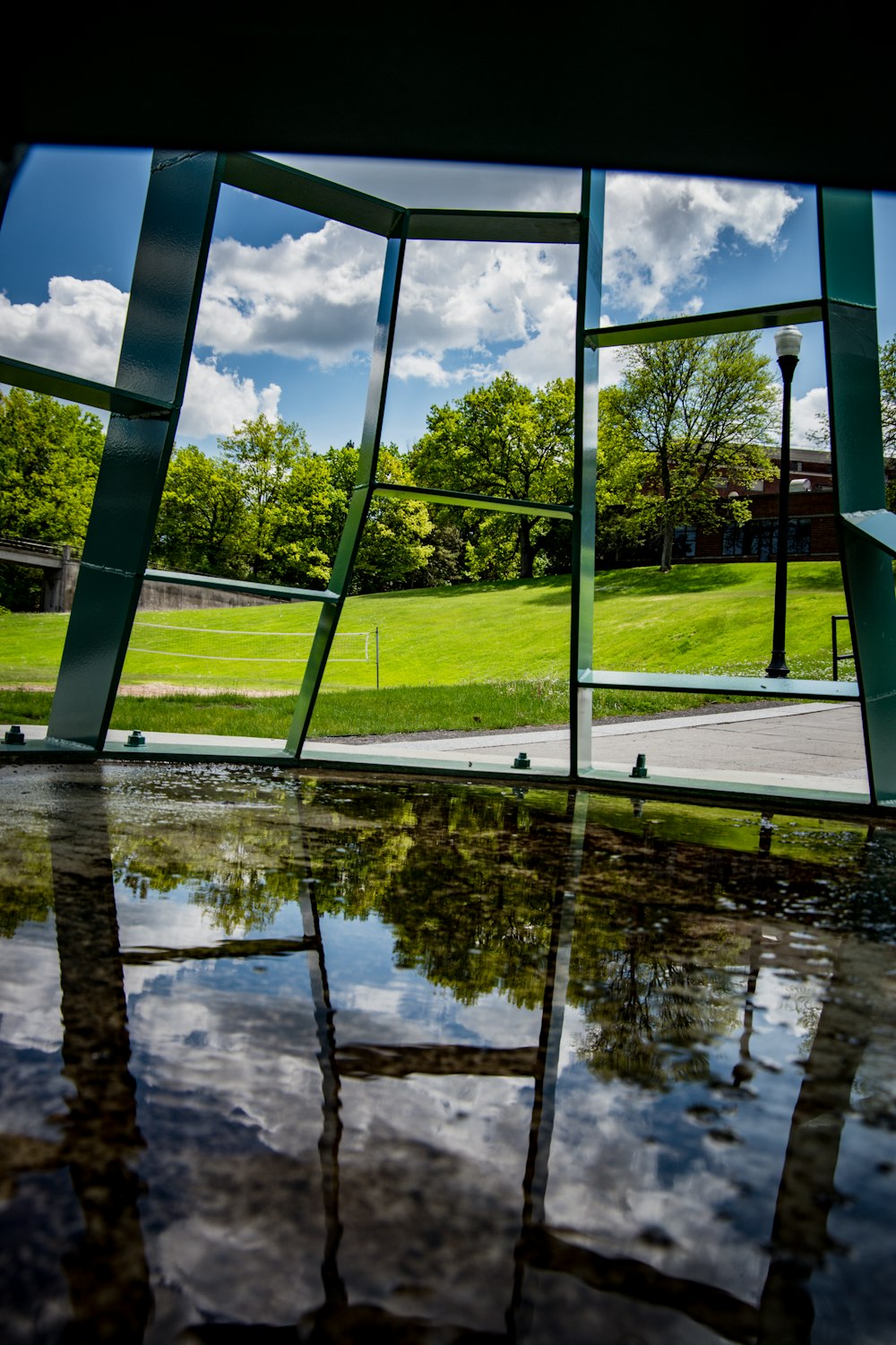 green-leafed trees near grey concrete table