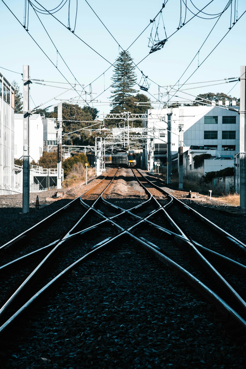 train tracks in the city during daytime